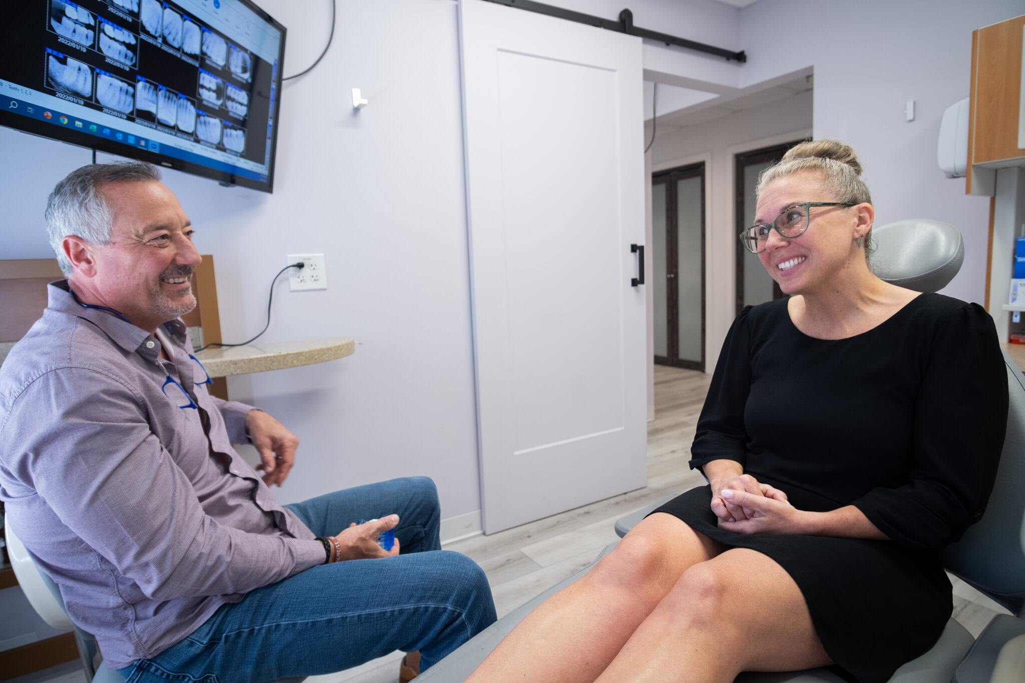 Dr. Kostrzewski speaking with a patient