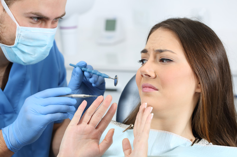dental-anxiety-fear-sedation-dentistry-solution-wilton-ct Anxious patient experiencing dental fear, sedation dentistry options available to help nervous patients relax at The Center for Complete Healthy Dentistry in Wilton, CT