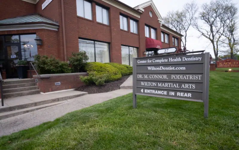 Exterior view and building sign for The Center for Complete Healthy Dentistry, your emergency dentist located at 27 in Wilton, CT